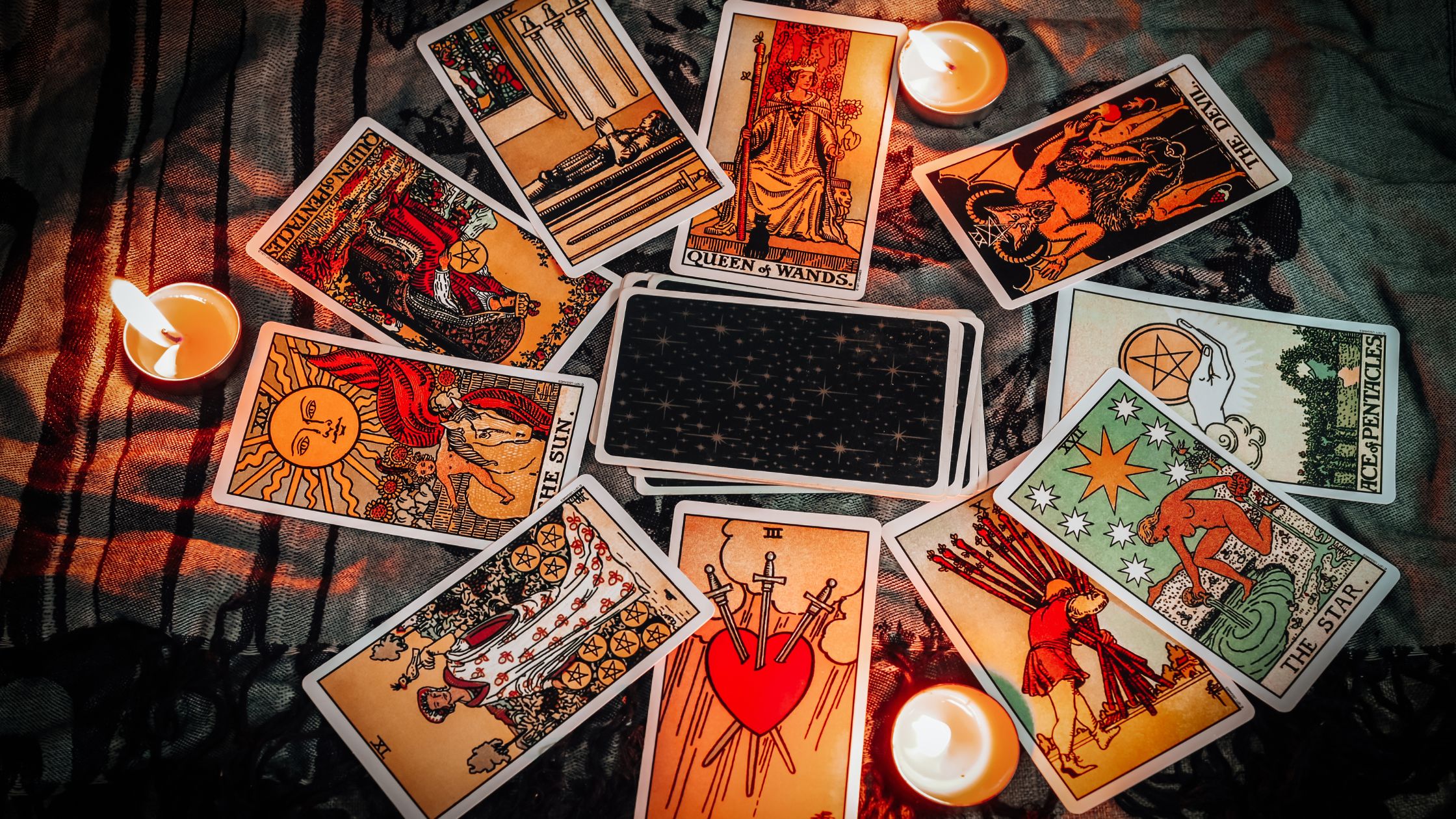 fall colored themed tarot cards in a circle around candles