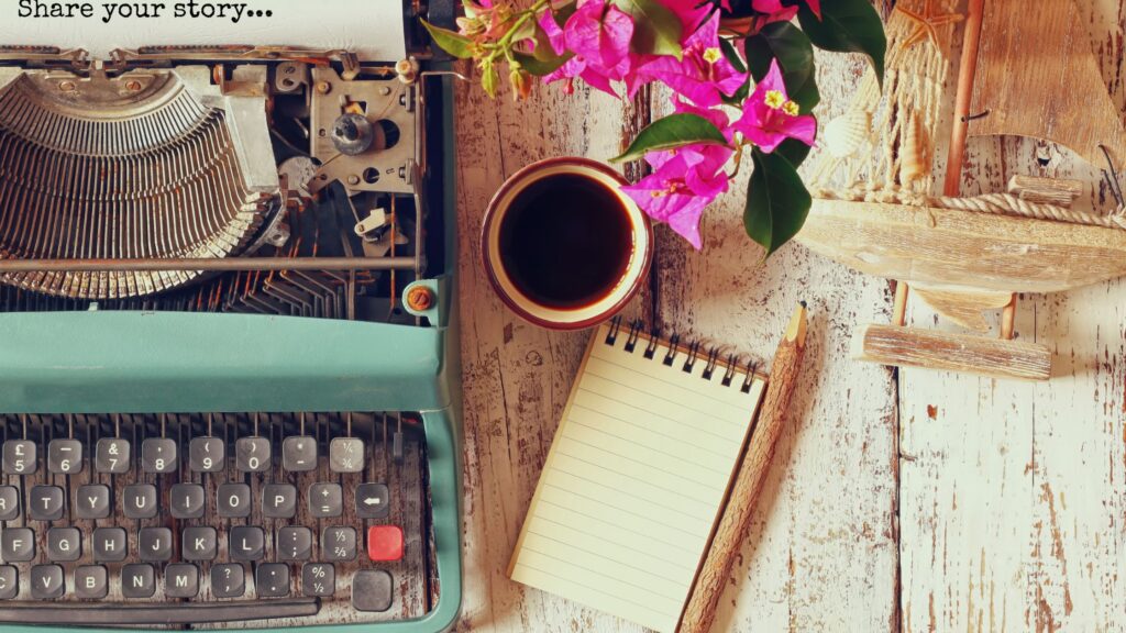 inspirational setting with blue typewriter, notepad and pencil, and coffee