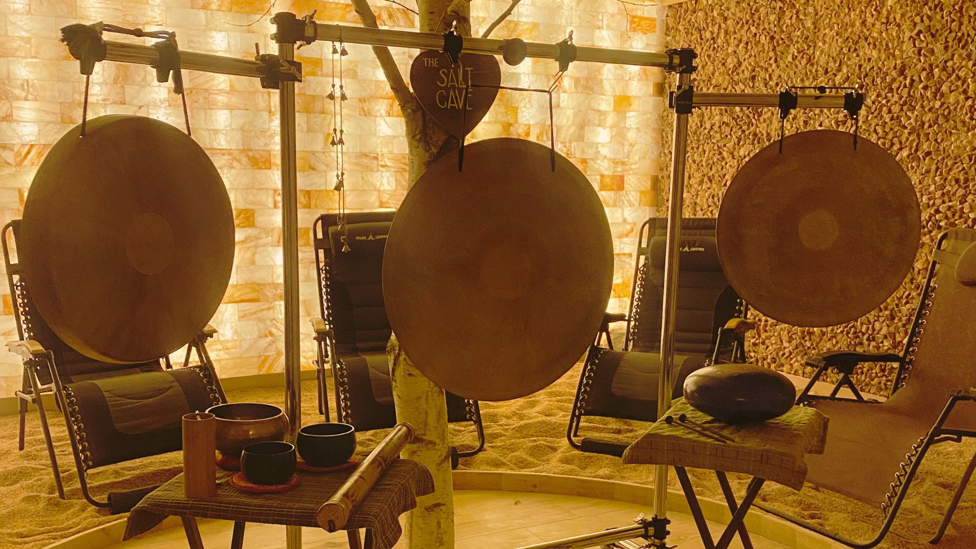 gongs and singing bowls set up for meditation in the soulshine salt cavern