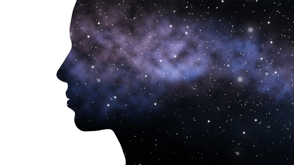 conscious awareness - silhouette of a face with cosmic space background