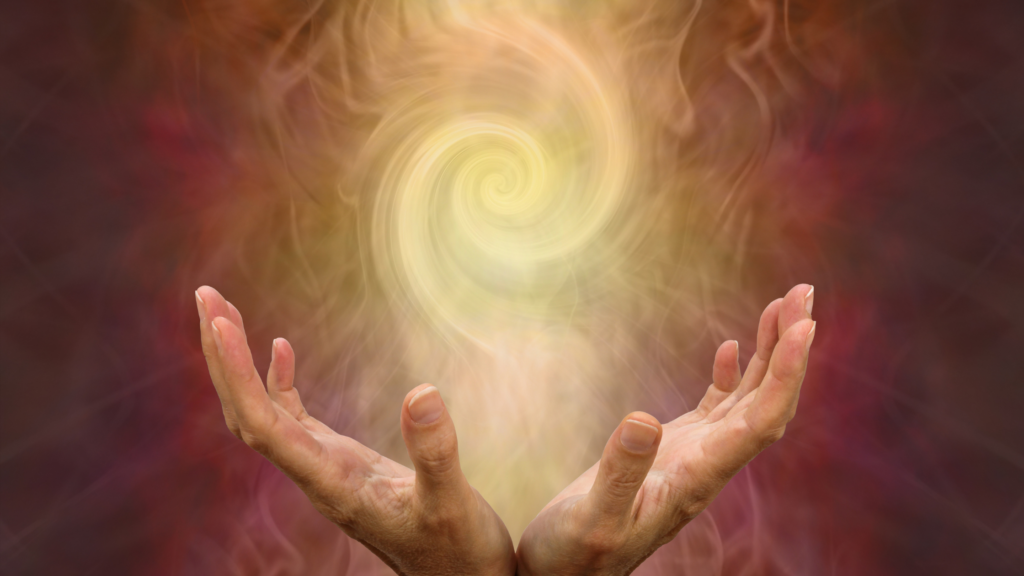 hands giving off energy for healing