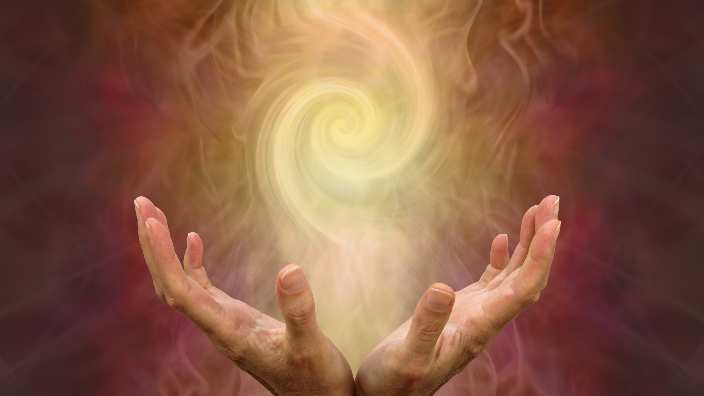 hands giving off energy for healing